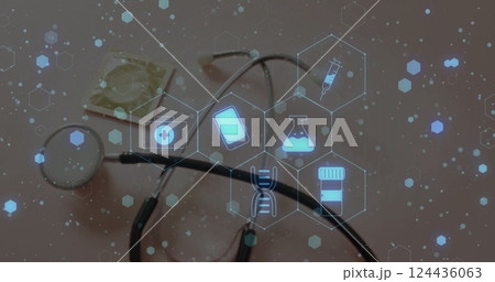 Image of medical icons over stethoscope on white background 124436063