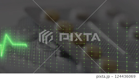 Image of cardiograph over pills 124436069