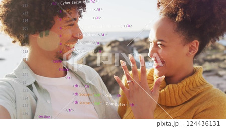 Image of data processing over african american couple embracing on beach 124436131