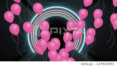 Image of pink party balloons floating over neon arch on black background 124438463