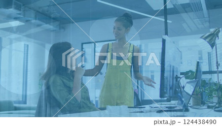 Image of financial data processing over diverse business people in office Image of financial data processing over diverse business people in office 124438490