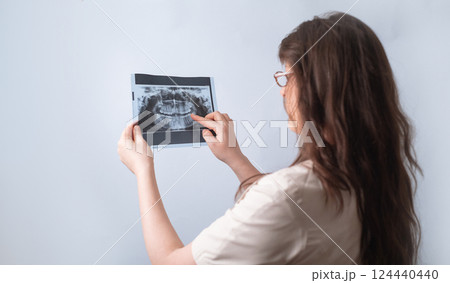 Modern dental technology: dentist uses X-ray for accurate detection of dental issues. Modern dental technology: dentist uses X-ray for accurate detection of dental issues. 124440440