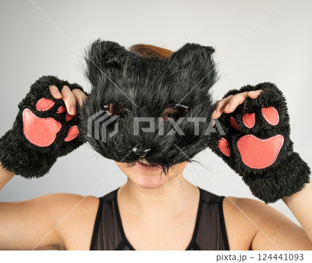 Portrait of a woman in a cat costume on a white background. Quadrober.  124441093