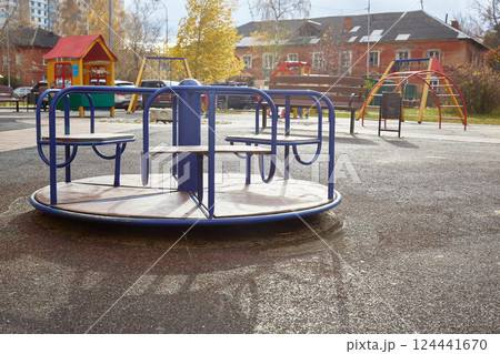 empty carousel on a playground on an autumn sunny day empty carousel on a playground on an autumn sunny day 124441670