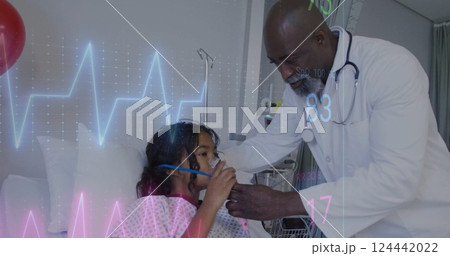 Image of cardiograph over diverse male doctor and girl patient in hospital 124442022