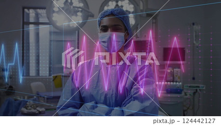 Image of cardiograph over biracial female surgeon in operating room 124442127
