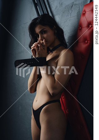 Woman Bound by Cuffs in Studio prepared for sexual bdsm game Woman Bound by Cuffs in Studio prepared for sexual bdsm game 124442549