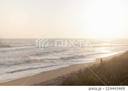 Sun setting over calm ocean and Cisco Beach Sun setting over calm ocean and Cisco Beach 124443469
