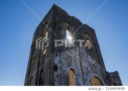 Low angle view of remains of Lithgow Blast Furnace against sky with sun 124443499