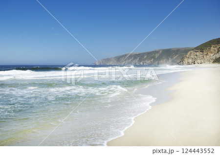 Sea waves on sandy beach Sea waves on sandy beach 124443552
