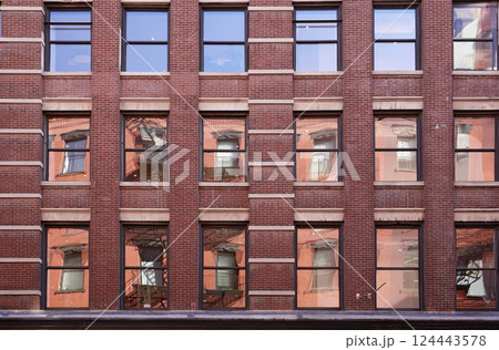 Rows of windows on facade of building 124443578