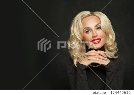 Happy young female model fashion beauty portrait. Elegant woman with long blond curly hairstyle 124443630