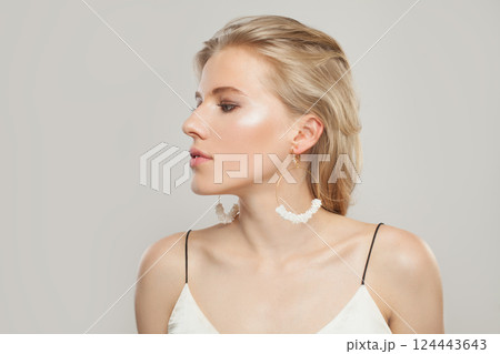 Glamorous blond model woman portrait. Beautiful face with healthy clear skin, long shiny hair Glamorous blond model woman portrait. Beautiful face with healthy clear skin, long shiny hair 124443643