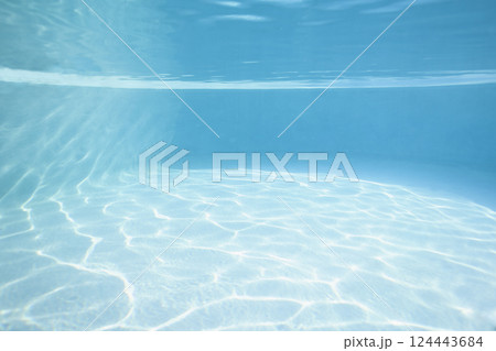 Turquoise water reflecting sunlight in swimming pool Turquoise water reflecting sunlight in swimming pool 124443684