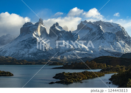Snow covered peaks of Torres Del Paine and Pehoe Lake 124443813