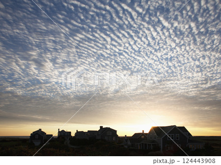 Clouds at sunrise over small village Clouds at sunrise over small village 124443908