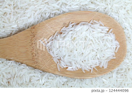Organic food background. Dry raw Long Grain Rice Organic food background. Dry raw Long Grain Rice 124444096
