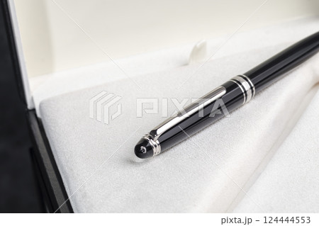Fountain pen on marble and grey background. Selective focus. 124444553