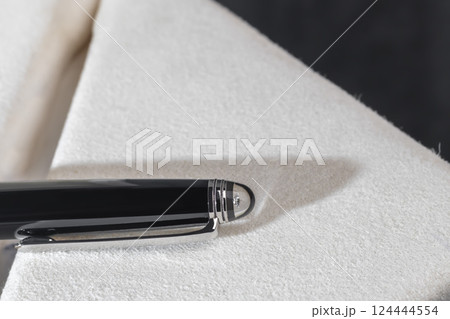 Fountain pen on marble and grey background. Selective focus. 124444554