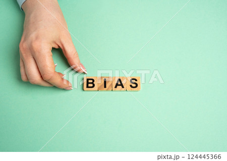 Wooden blocks with the word Bias. Prejudice. Personal opinions. Preconception 124445366