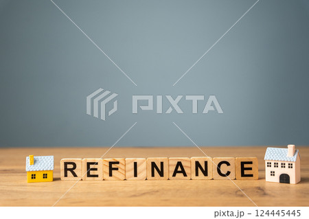 Wooden blocks with the words Refinance and miniature houses. Real estate concept. Business and finance. Mortgage, loan. Interest rates. Home lending Wooden blocks with the words Refinance and miniature houses. Real estate concept. Business and finance. Mortgage, loan. Interest rates. Home lending 124445445
