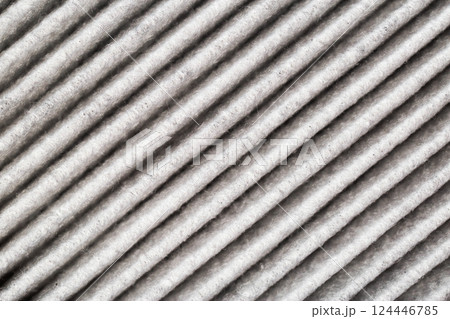 Background of modern carbon filter for air purification in car interior, close-up 124446785