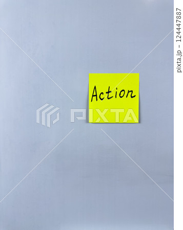 Sticky note with Action written on it, affixed to white background. This image represents initiative and productivity, ideal for themes of taking action and making progress Sticky note with Action written on it, affixed to white background. This image represents initiative and productivity, ideal for themes of taking action and making progress 124447887