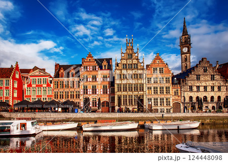 Ghent city historical center, tourists boats and colorful buildings on Leie river bank, Belgium 124448098