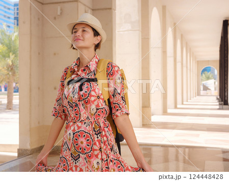 Young female tourist exploring iconic landmarks of the United Arab Emirates. Young female tourist exploring iconic landmarks of the United Arab Emirates. 124448428