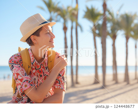 Woman strolls through colorful streets of Spanish coastal town Woman strolls through colorful streets of Spanish coastal town 124448677