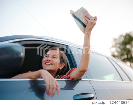 Traveler woman drives car through scenic countryside of Croatia 124448684