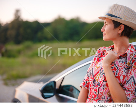 Traveler woman drives car through scenic countryside of Croatia Traveler woman drives car through scenic countryside of Croatia 124448688