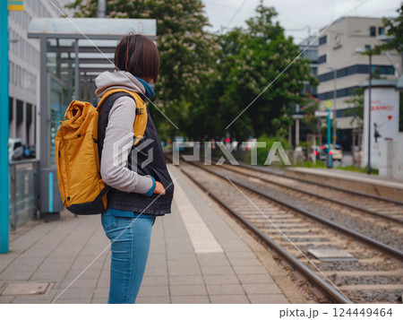 Tourist woman stands at tram stop in Frankfurt 124449464