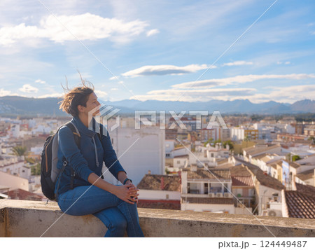 Young woman exploring historic castle in Denia 124449487