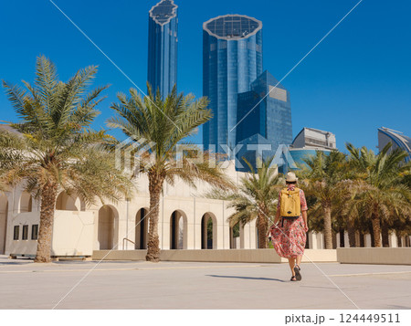 Young female tourist exploring iconic landmarks of the United Arab Emirates. Young female tourist exploring iconic landmarks of the United Arab Emirates. 124449511