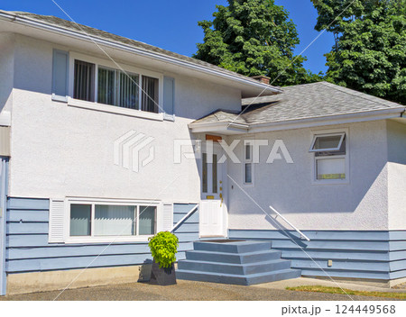 A perfect neighbourhood. Door steps and decorative flower in front of residential house entrance 124449568