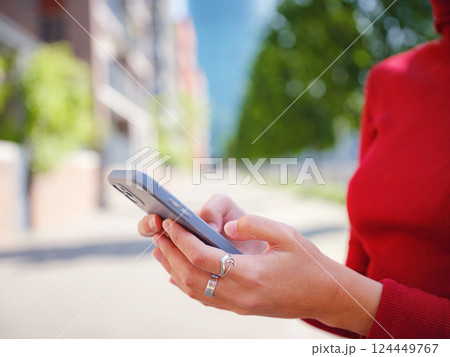 Woman in glasses stands in center of Frankfurt, 124449767