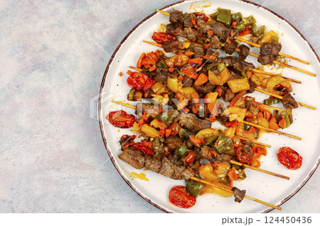Juicy lamb kebab with vegetables 124450436