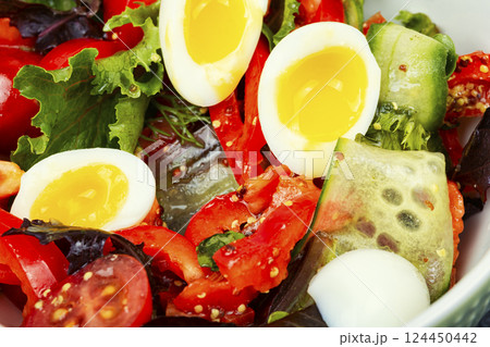 Salad with vegetables and eggs, keto diet. 124450442