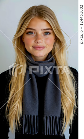A woman with long blonde hair wearing a gray scarf 124451002