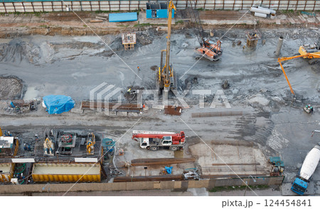 Top view of construction with cranes and excavators and heavy equipment 124454841