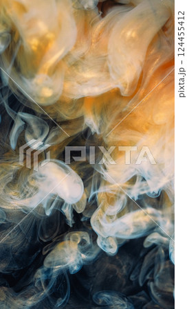 Art cloud. Shimmering mist. Golden yellow paint spill swirl abstract background. Fume color dye water shiny emulsion defocused steam. 124455412