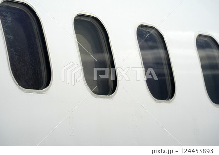 airplane detail of cabin windows and fuselage airplane detail of cabin windows and fuselage 124455893