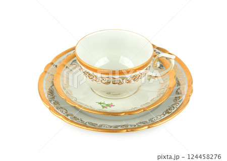 Porcelain vintage cup and saucer isolated on white. Vintage Bavarian teaware. Porcelain vintage cup and saucer isolated on white. Vintage Bavarian teaware. 124458276