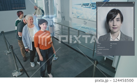 Airport Checkpoint: Multiethnic People Passing AI Biometric Facial Recognition at Passport Control 124458500