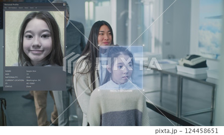 Queue of Diverse People Passing Biometric AI Face Identification at Border Control in Airport Terminal Queue of Diverse People Passing Biometric AI Face Identification at Border Control in Airport Terminal 124458651