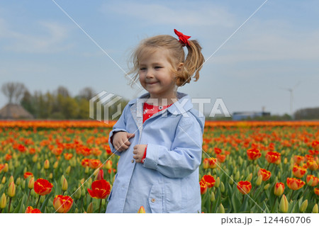 Girl running in a orange tulip field 124460706