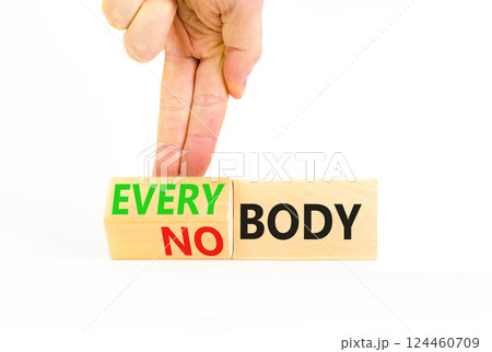 Everybody vs nobody symbol. Concept words Everybody and Nobody on wooden cubes. Beautiful white table white background. Businessman hand. Business and everybody vs nobody concept. Copy space. Everybody vs nobody symbol. Concept words Everybody and Nobody on wooden cubes. Beautiful white table white background. Businessman hand. Business and everybody vs nobody concept. Copy space. 124460709