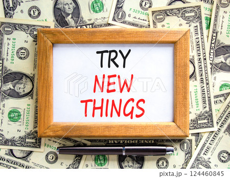 Try new things symbol. Concept words Try new things on beautiful picture frame. Black pen. Beautiful background from dollar bills. Business motivational lifestyle try new things concept. Copy space. Try new things symbol. Concept words Try new things on beautiful picture frame. Black pen. Beautiful background from dollar bills. Business motivational lifestyle try new things concept. Copy space. 124460845