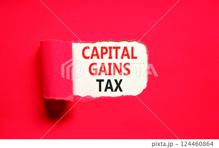 Capital gains tax symbol. Concept words Capital gains tax on beautiful white paper. Beautiful red paper background. Business and capital gains tax concept. Copy space. 124460864